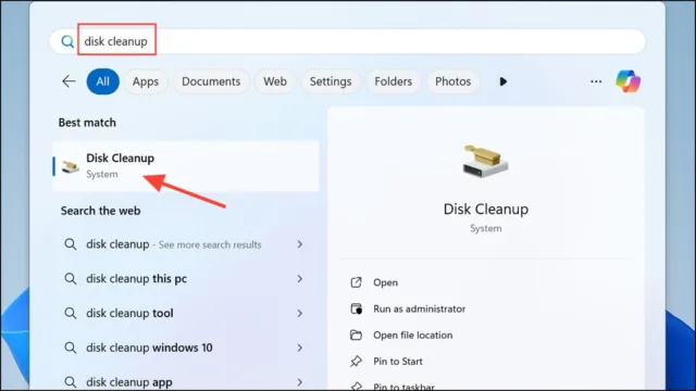 به طور جایگزین، از Disk Cleanup استفاده کنید. برای این کار، نام آن را در نوار جستجوی منوی Start تایپ کرده و درایو اصلی خود (معمولاً C:) را انتخاب کنید.