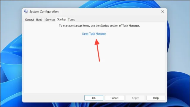 به تب Startup بروید و روی گزینه Open Task Manager کلیک کنید